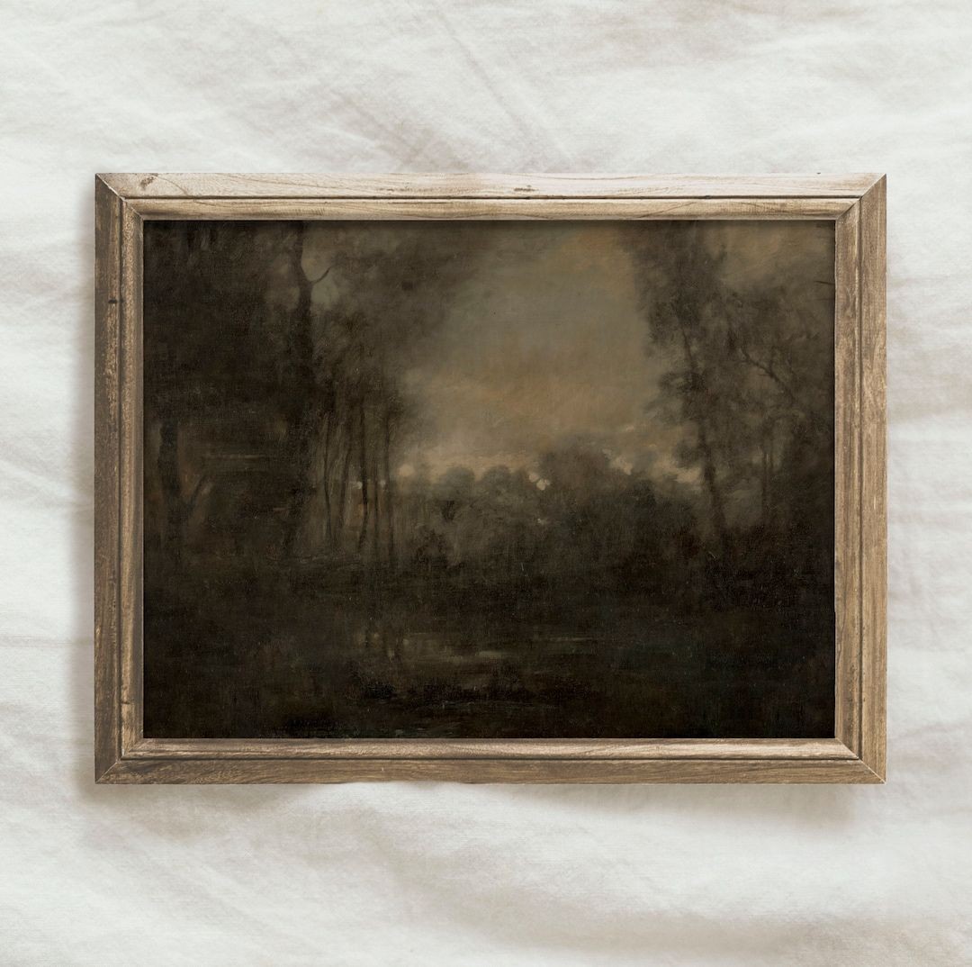 Dark landscape painting in rustic frame